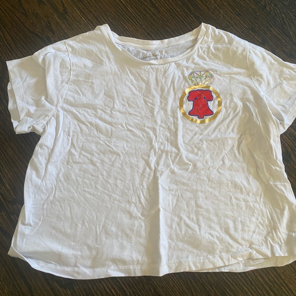 White T-Shirt with Phillies bell + engagement ring